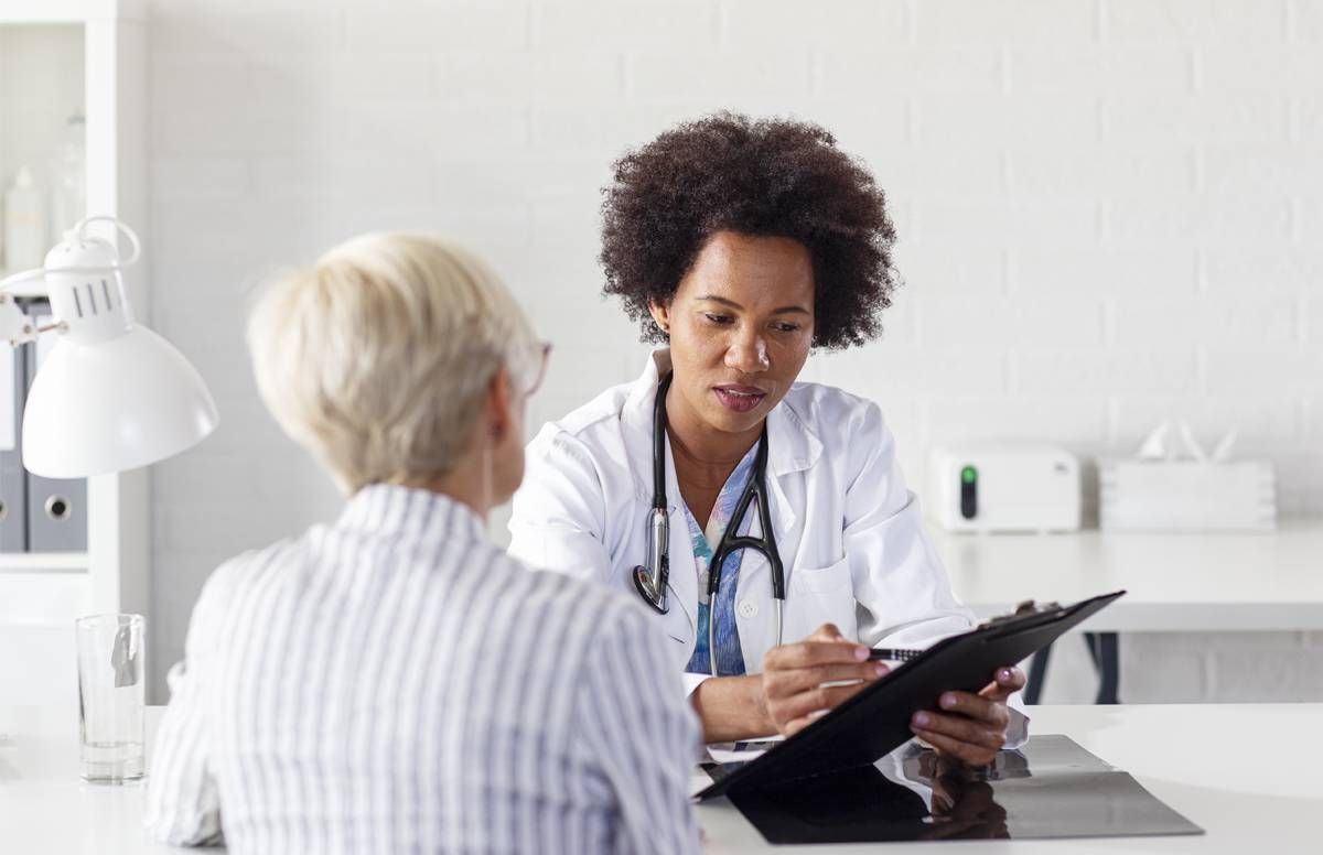 woman consulting with physician