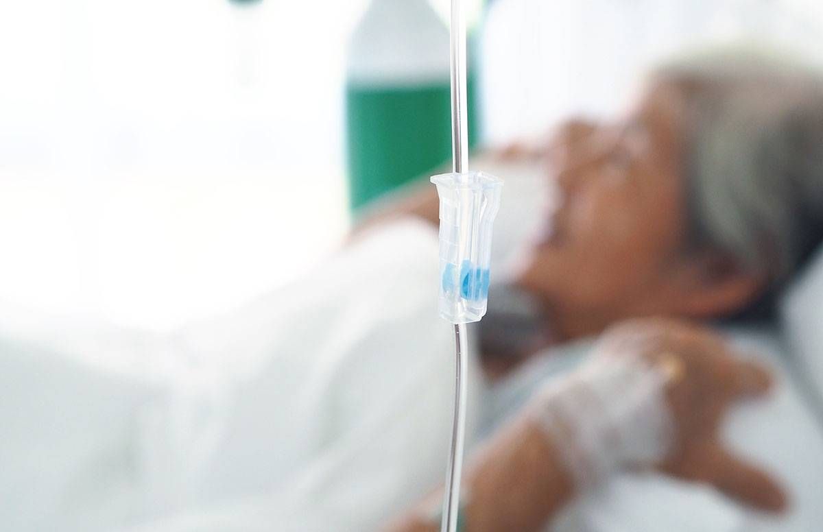 elderly person in hospital bed