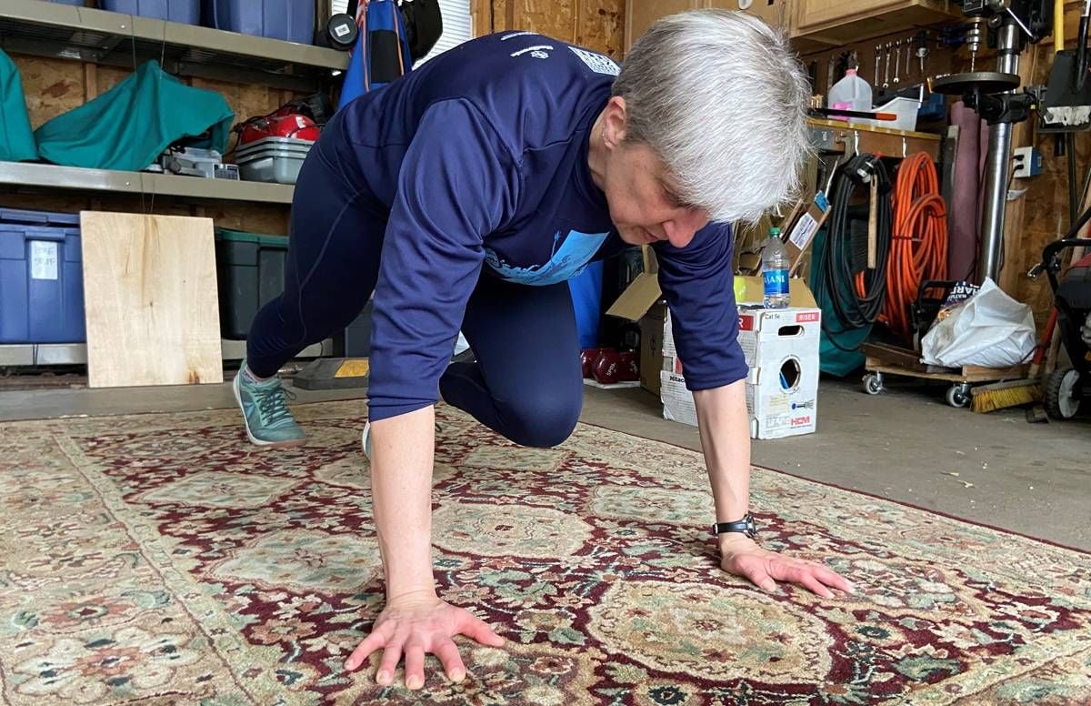 Erika Nelson often moves her car our of her St. Paul, Minn., garage to practice yoga and do exercises