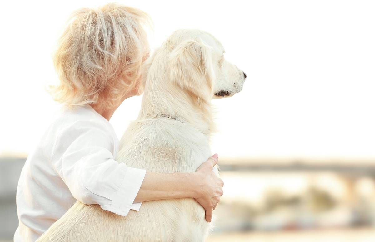 woman and dog looking into distance