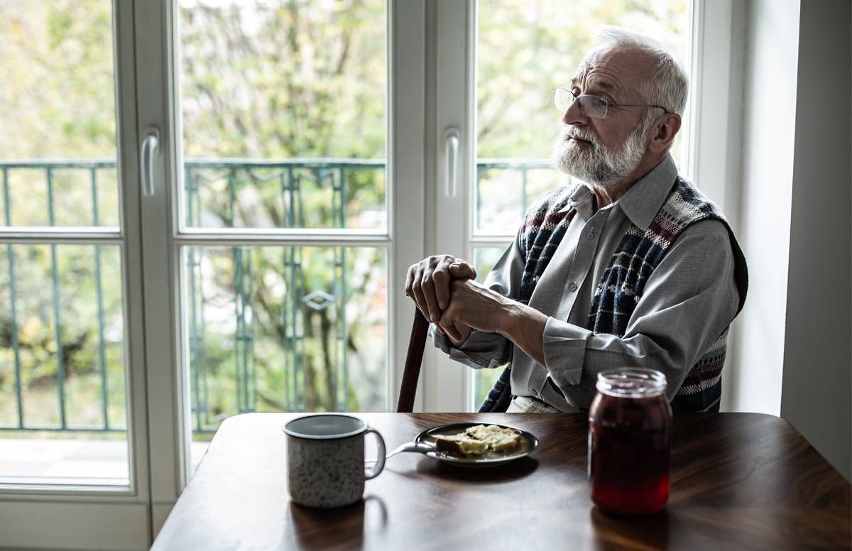 Man alone in kitchen