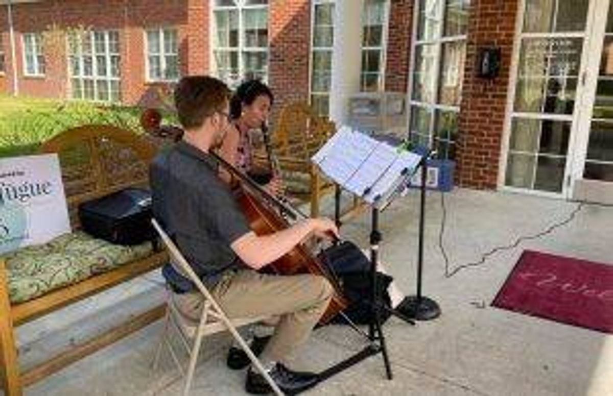 Tidewater Arts musicians play outside a senior facility in Chesapeake, Va. 