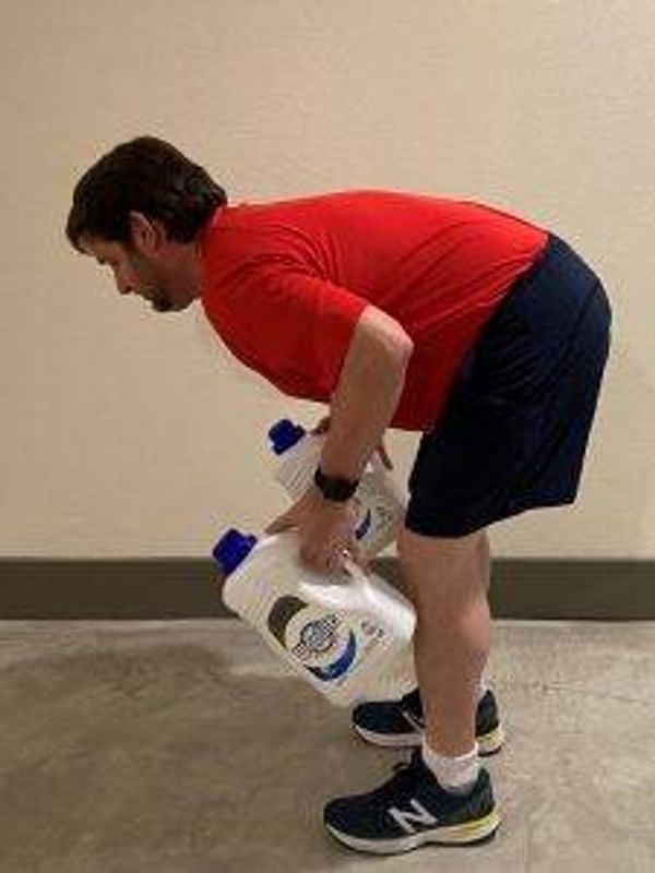 Tom Hippman, of Dallas, finds common household items to use for weight training