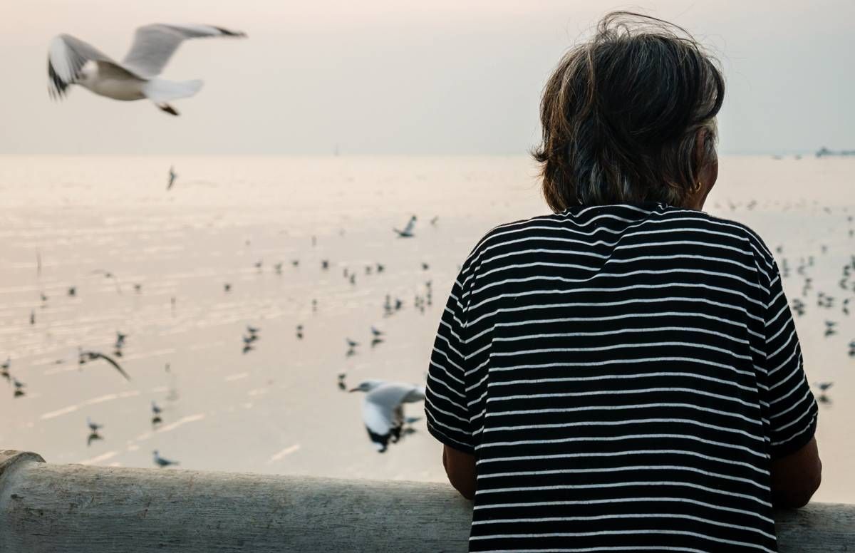 Woman looking out at the sea