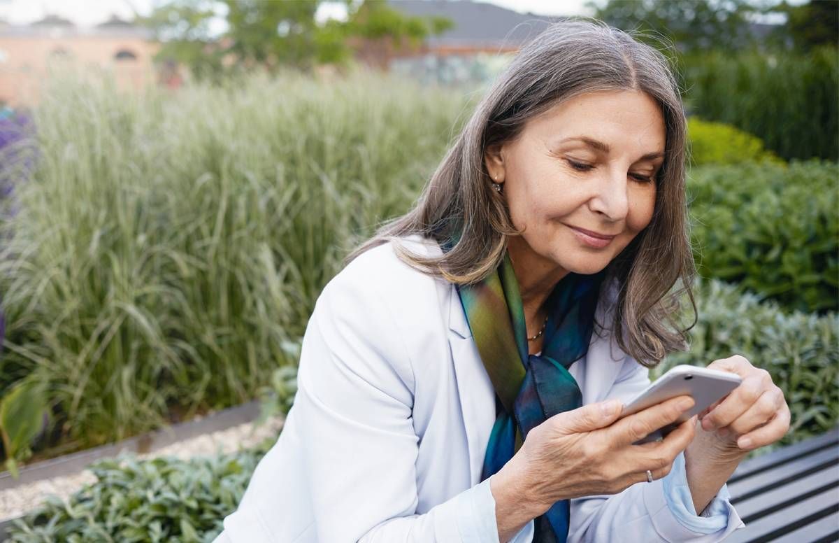 person outside, on her smart phone