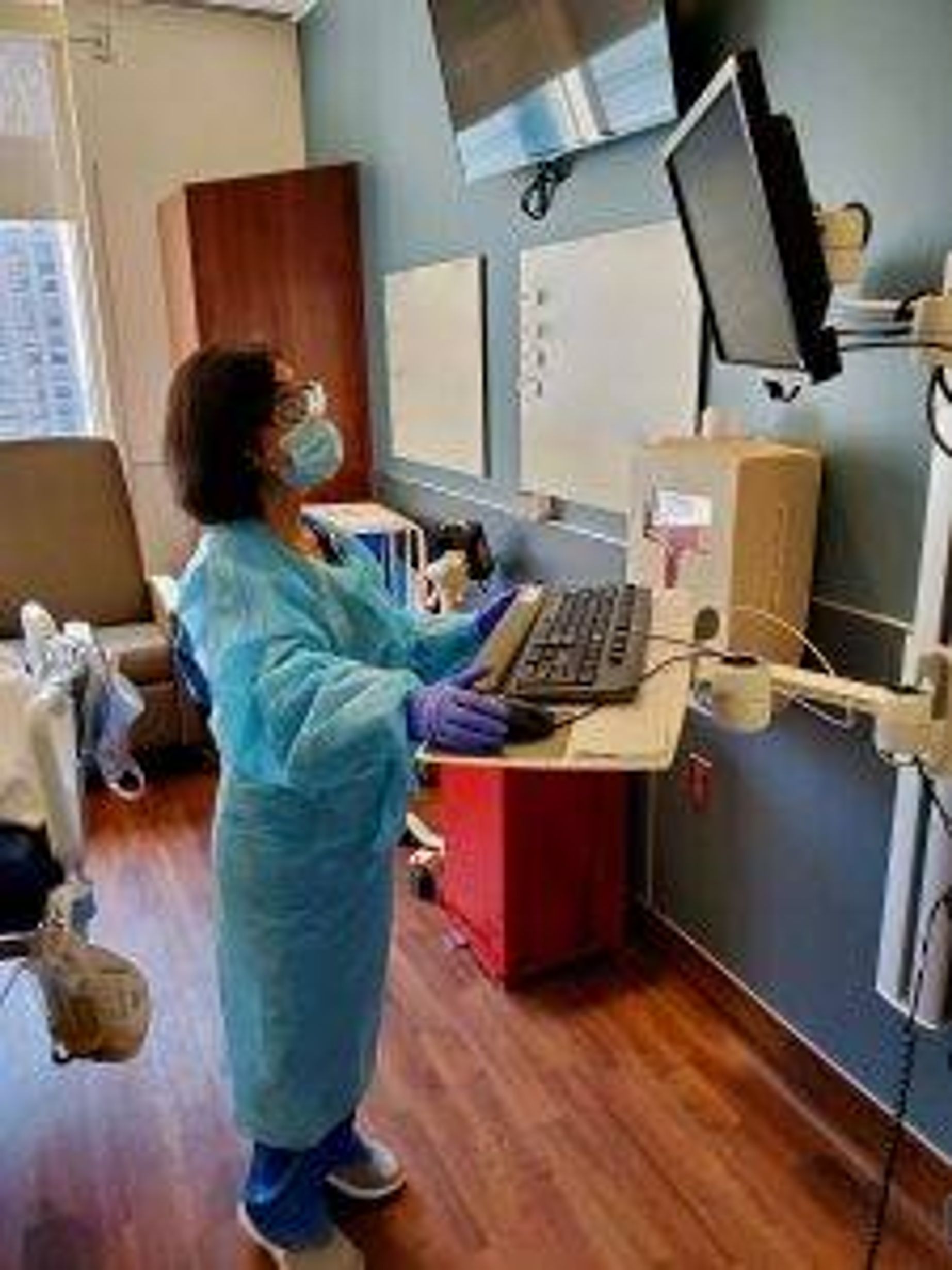 Charge nurse Raquel "Rocky" Callanto in a patient's room