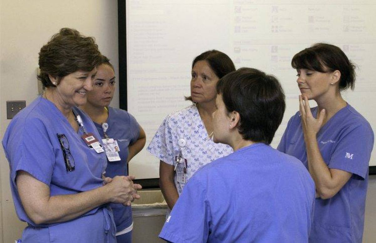 Veteran nurse Susan O'Connell meets with younger nurses