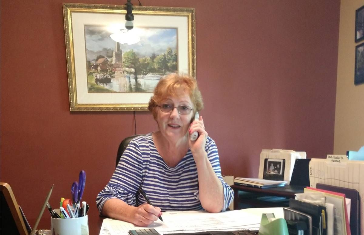 woman on phone at desk