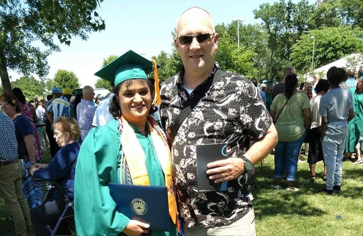 Allison Clemens-Roberts with her husband Frank at Goodwin University graduation in 2019. She switched from a bank analyst job to being a computerized machine operator for TOMZ in Berlin, Conn.