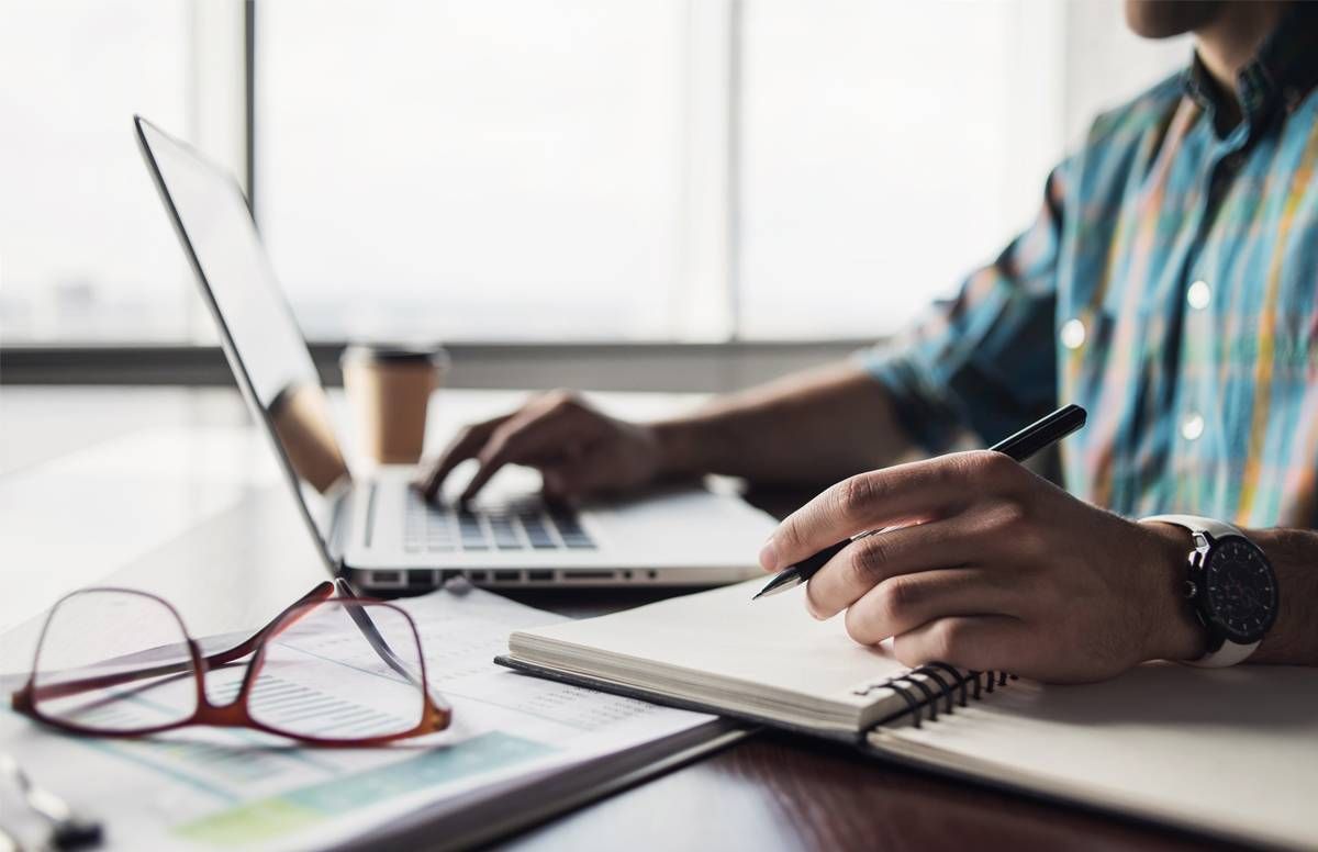 Man at a computer engaging in professional development