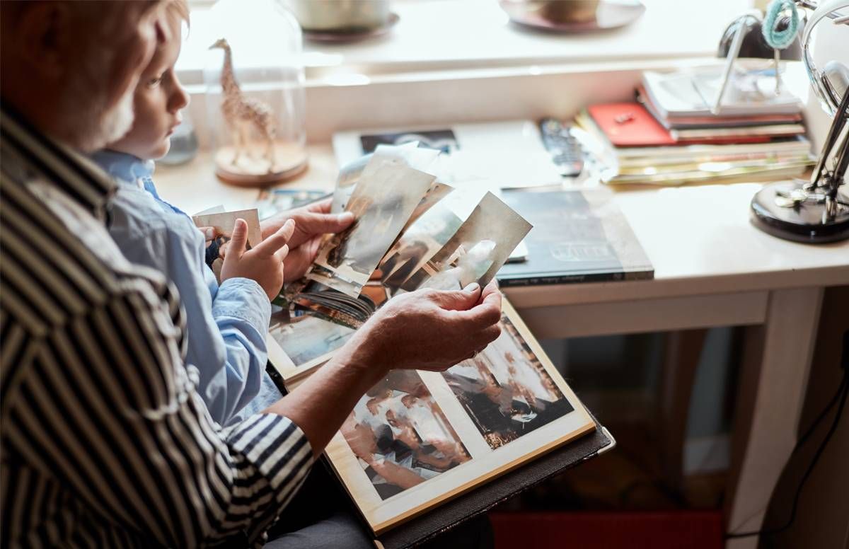 grandpa and grandson looking at photos