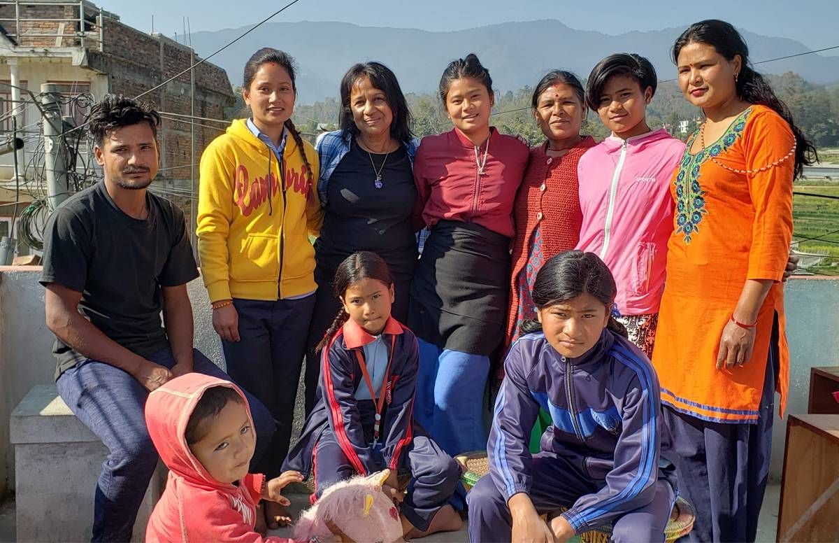 Kamana Mathur, center, with her host family in Panauti, Nepal