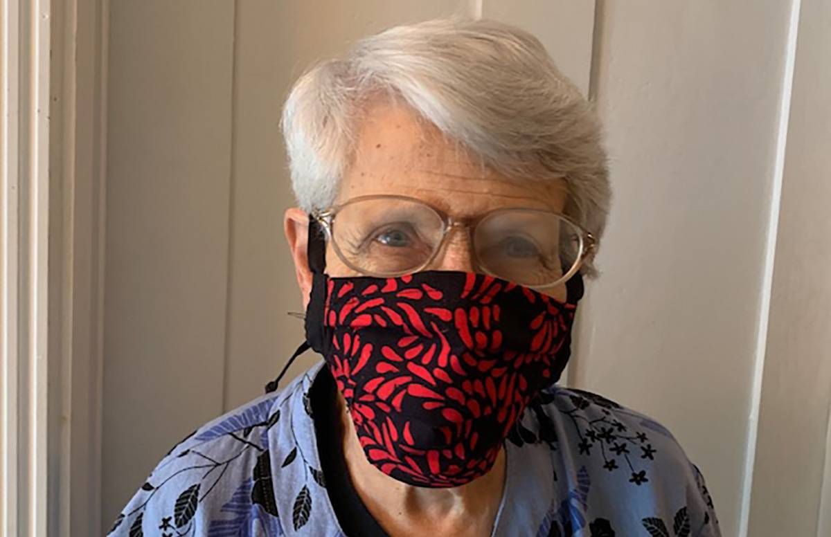 older person with COVID-19 mask
