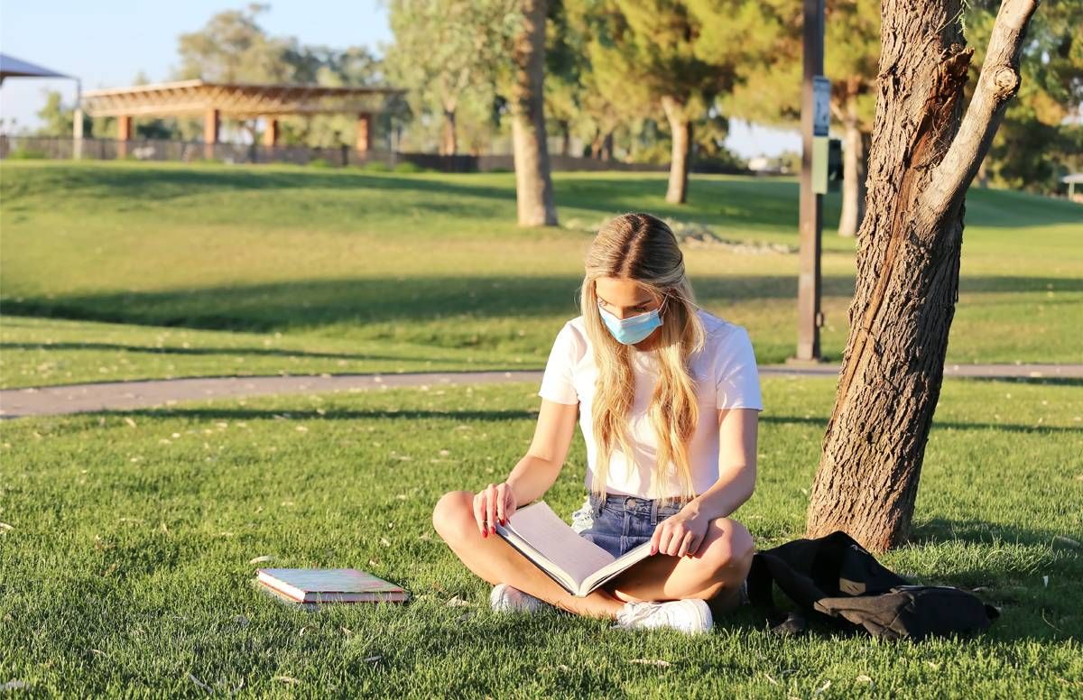 Female college student with books outside