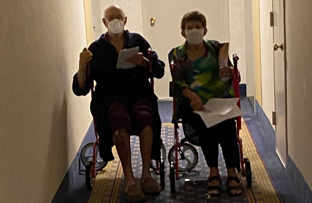 The author's parents in the hallway of their apartment building