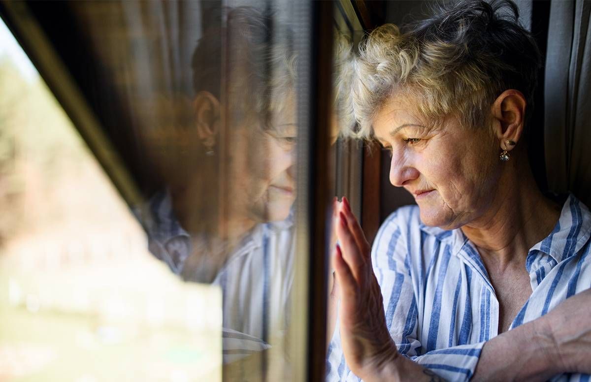 woman looking out window