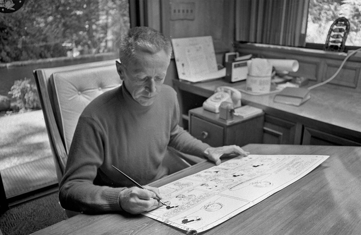 Charles M. Schulz at his drafting table, 1969