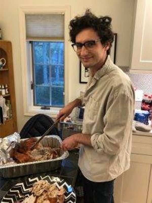 Will Eisenberg carves the turkey