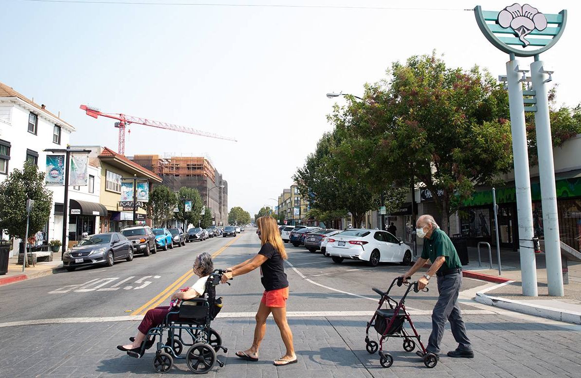 June Yasuhara crosses the street with her parents in San Jose's Japandown