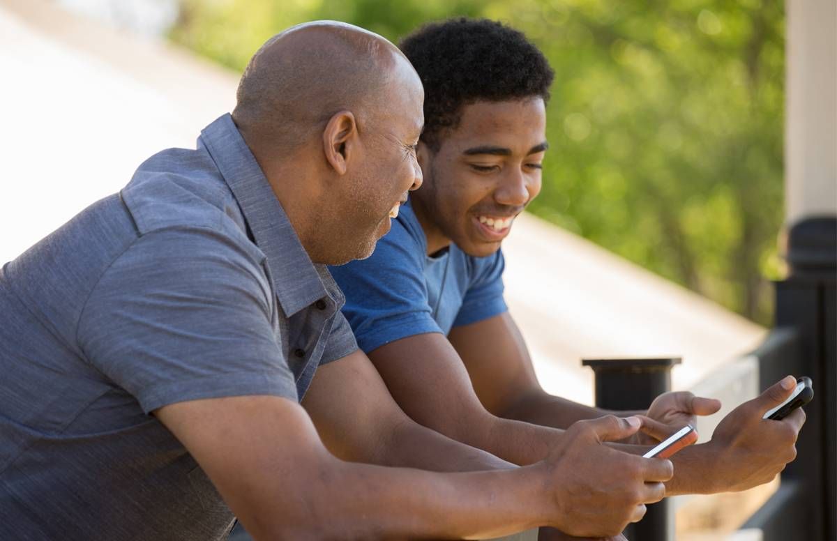 Dad and son on phones