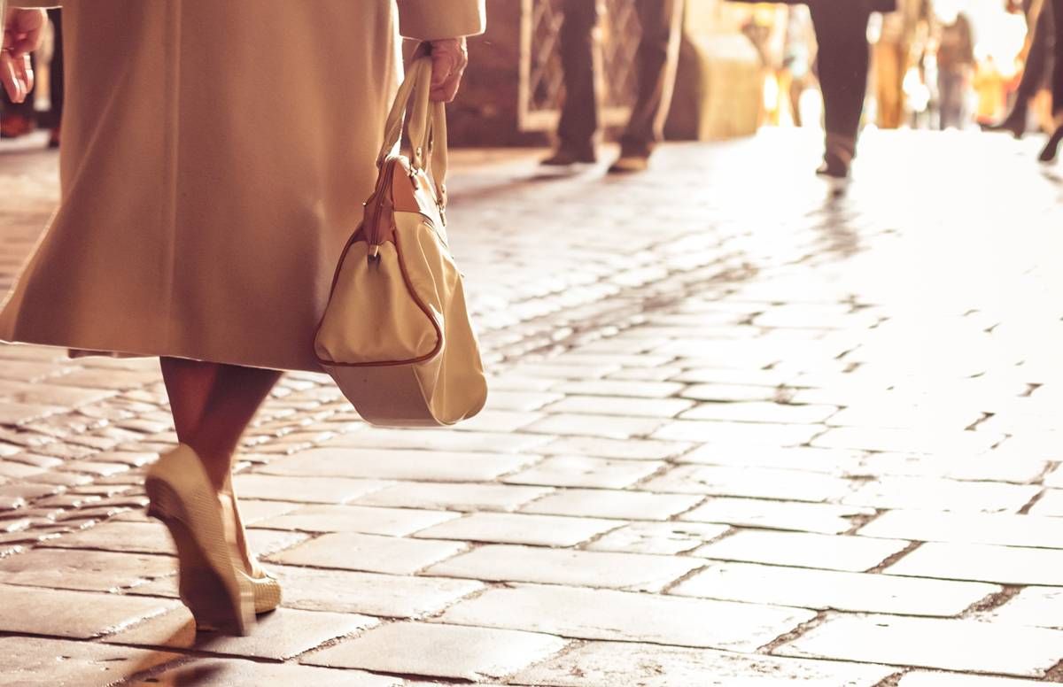 woman walking with purse