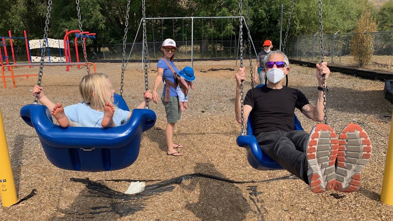 Marc and his granddaughter Jolene swinging, with daughter Maya and grandson Conrad in background. Photo by Daniela Silver, grandchildren, Next Avenue