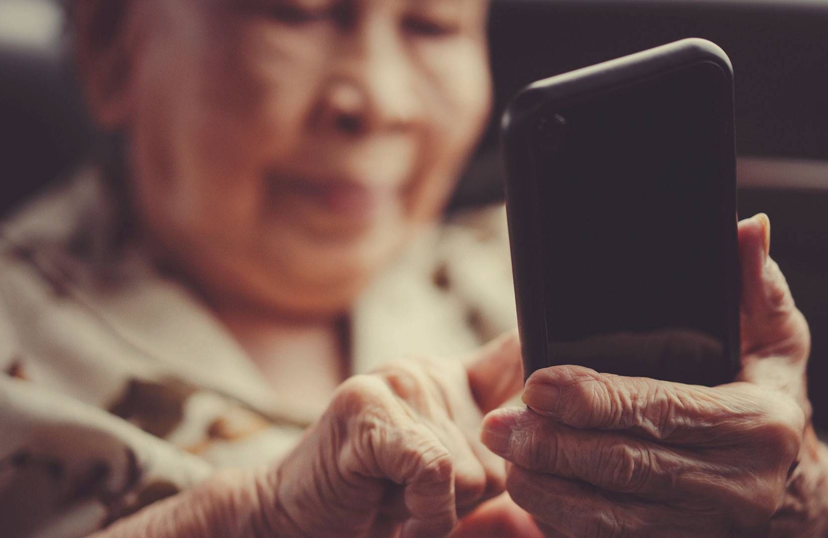 an older woman using a smart phone