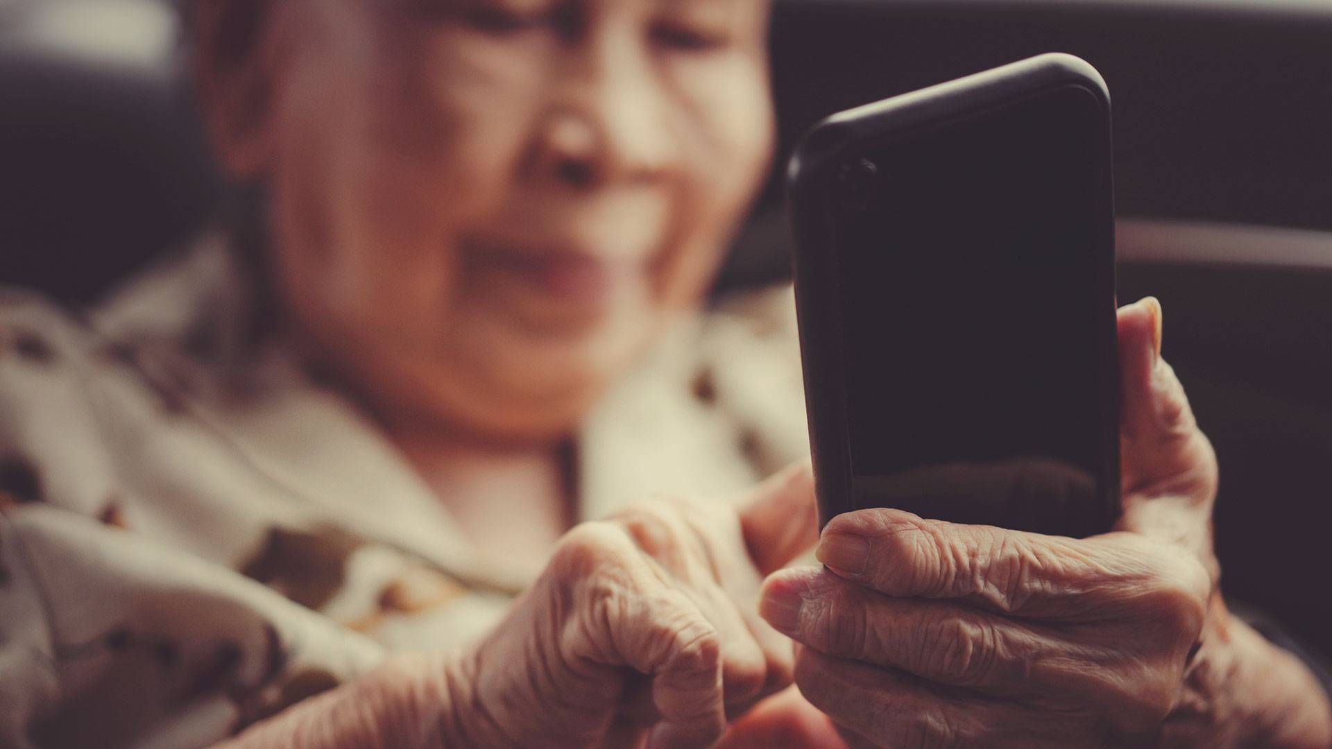 an older woman using a smart phone