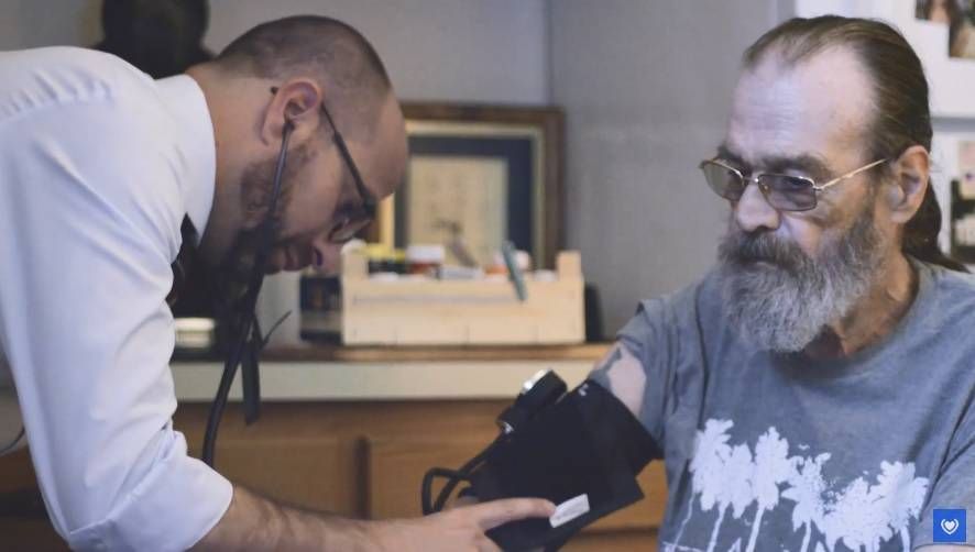 Doctor with patient in blood pressure cuff, next avenue, health care, assisted living