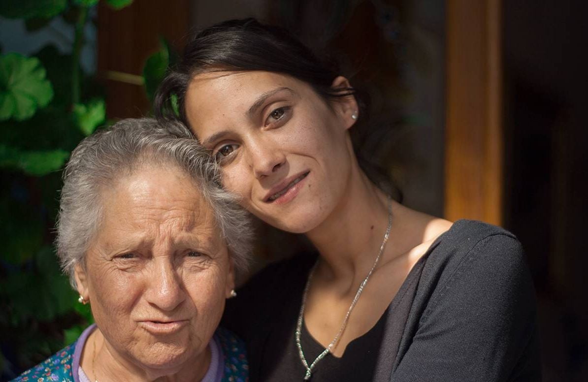 older latina woman and her daughter