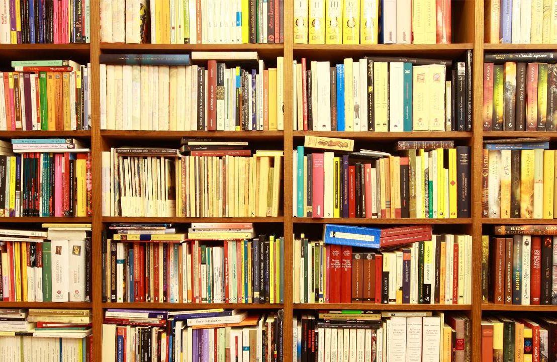 Case of colorful books, downsizing, downsize, next avenue