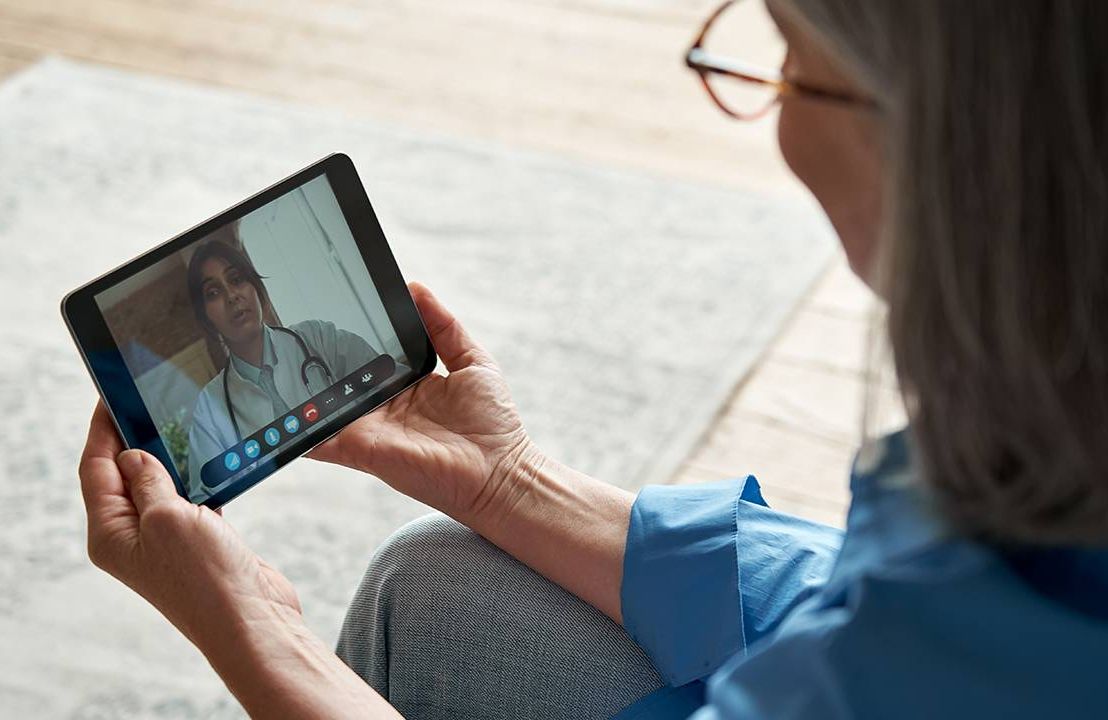 Older adult using Telehealth for a doctor appointment, technology and connecting