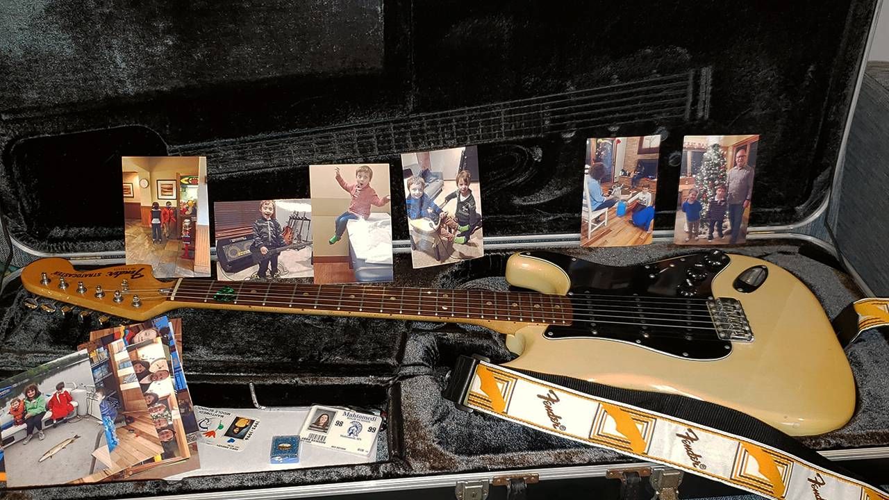 Fender electric guitar and photos of grandchildren, music, Next Avenue