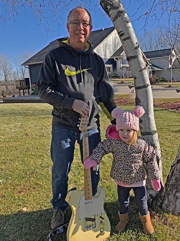 John Rawson outside with his granddaughter and a guitar, music, Next Avenue