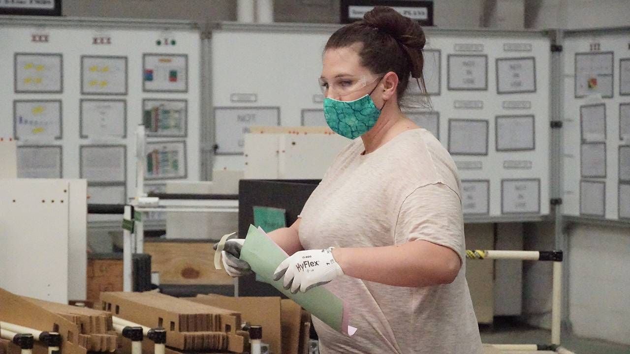 One Herman Miller factory worker wearing protective gear, older workers, ageism, Next Avenue