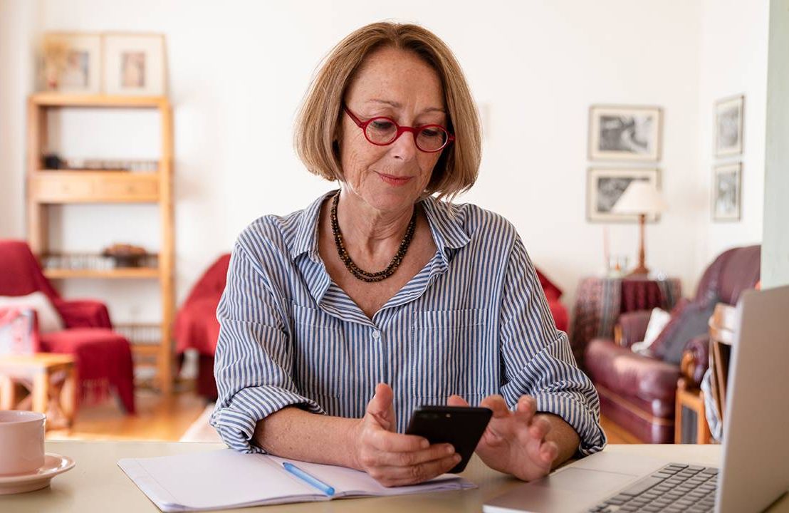 Older woman working from home on her computer, ageism at work, Next Avenue