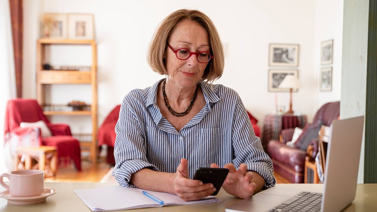 Older woman working from home on her computer, ageism at work, Next Avenue