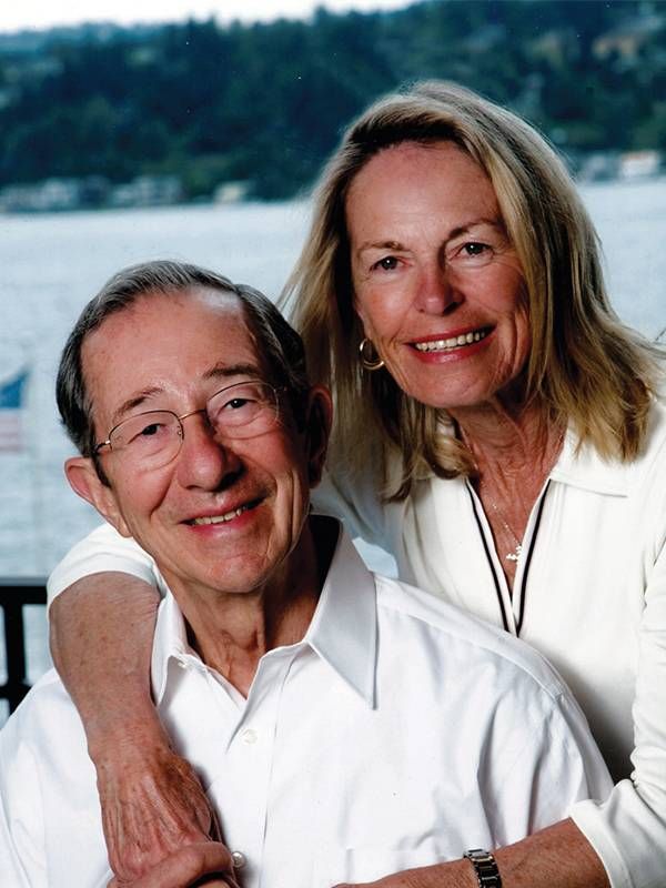 A husband and wife smiling in front of a lake, dementia, Alzheimer's, Next Avenue