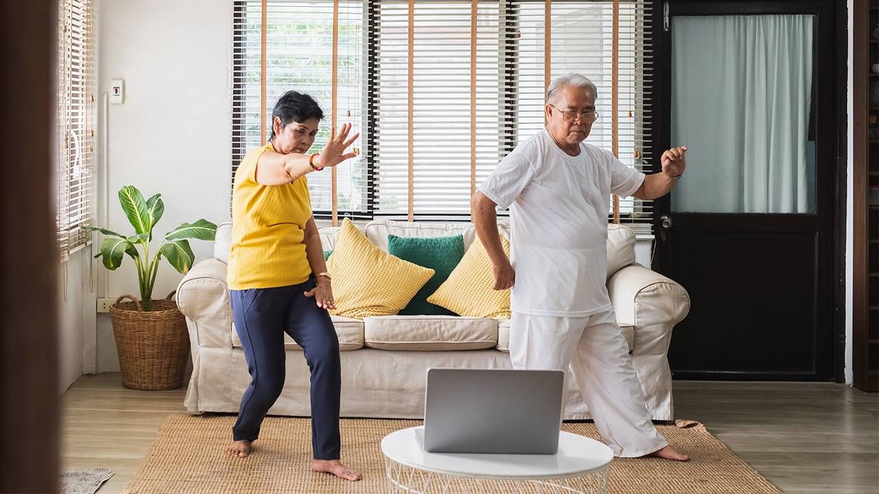 Couple doing Tai-Chi at home, independent living, Next Avenue