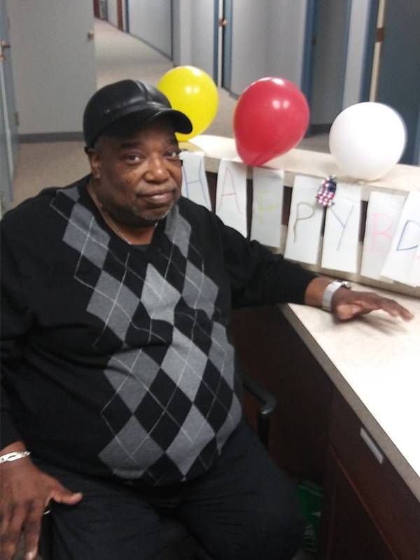 Man sitting at desk, low-income, jobs, Next Avenue