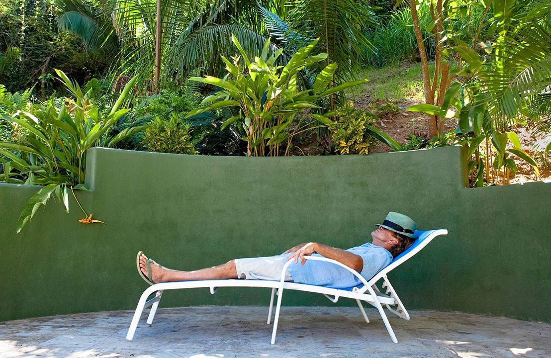 An older man napping in a chaise lounge outside, naps, sleep science, Next Avenue