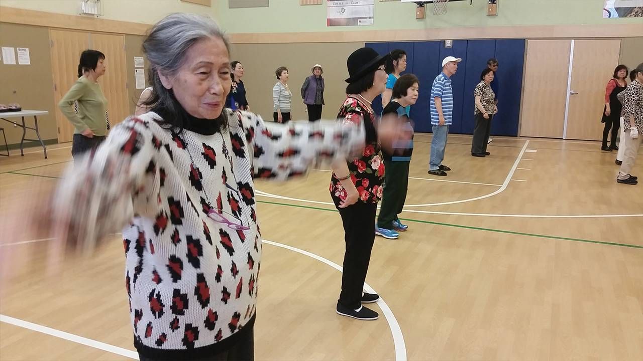 A group of older adults with in a gymnasium, dementia, Alzheimer's, Next Avenue