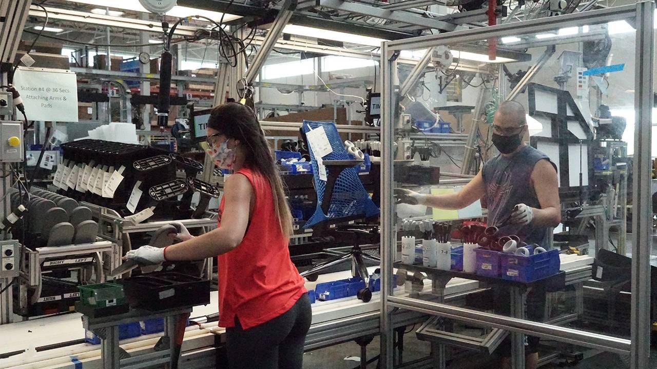 Two factory workers at the Herman Miller factory, older workers, ageism, Next Avenue