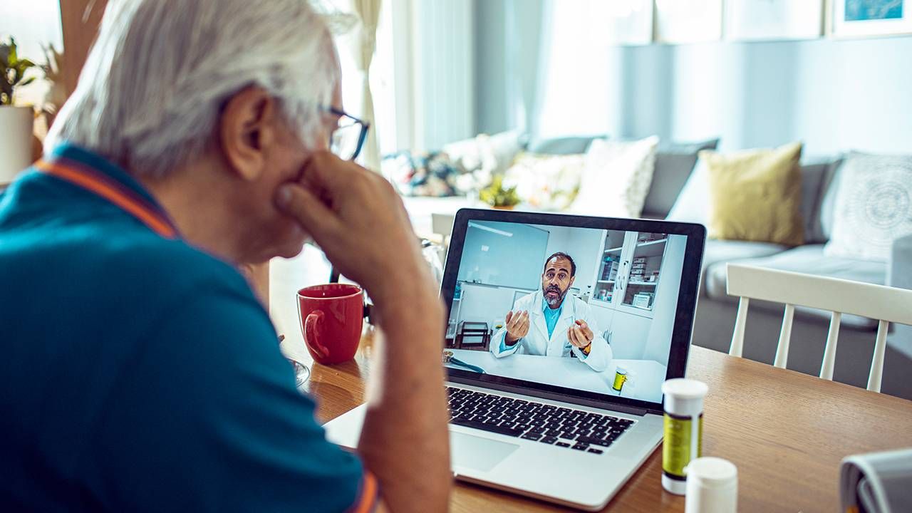 Older man talking with doctor during a virtual appointment, Next Avenue