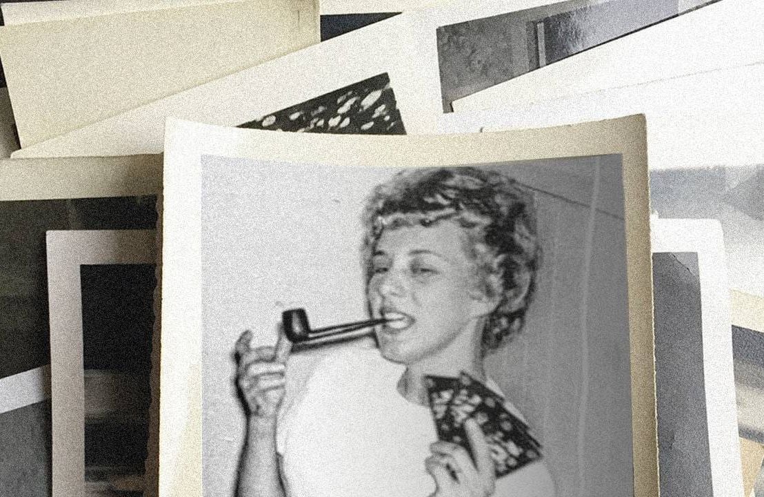 Old photo of a woman smoking a pipe playing cards, writing obituary, Next Avenue