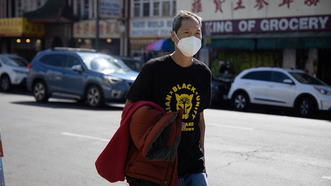 Older man walking down street in chinatown, hate crimes, activism, Next Avenue