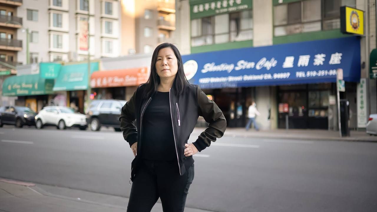 Woman standing on street in chinatown, hate crimes, activism, Next Avenue