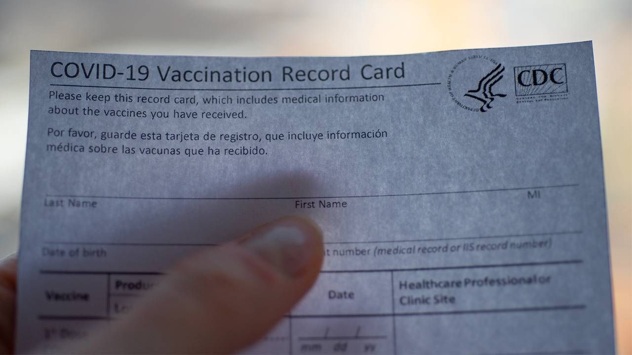 COVID-19 vaccination record card from CDC, vaccine hesitancy, Next Avenue