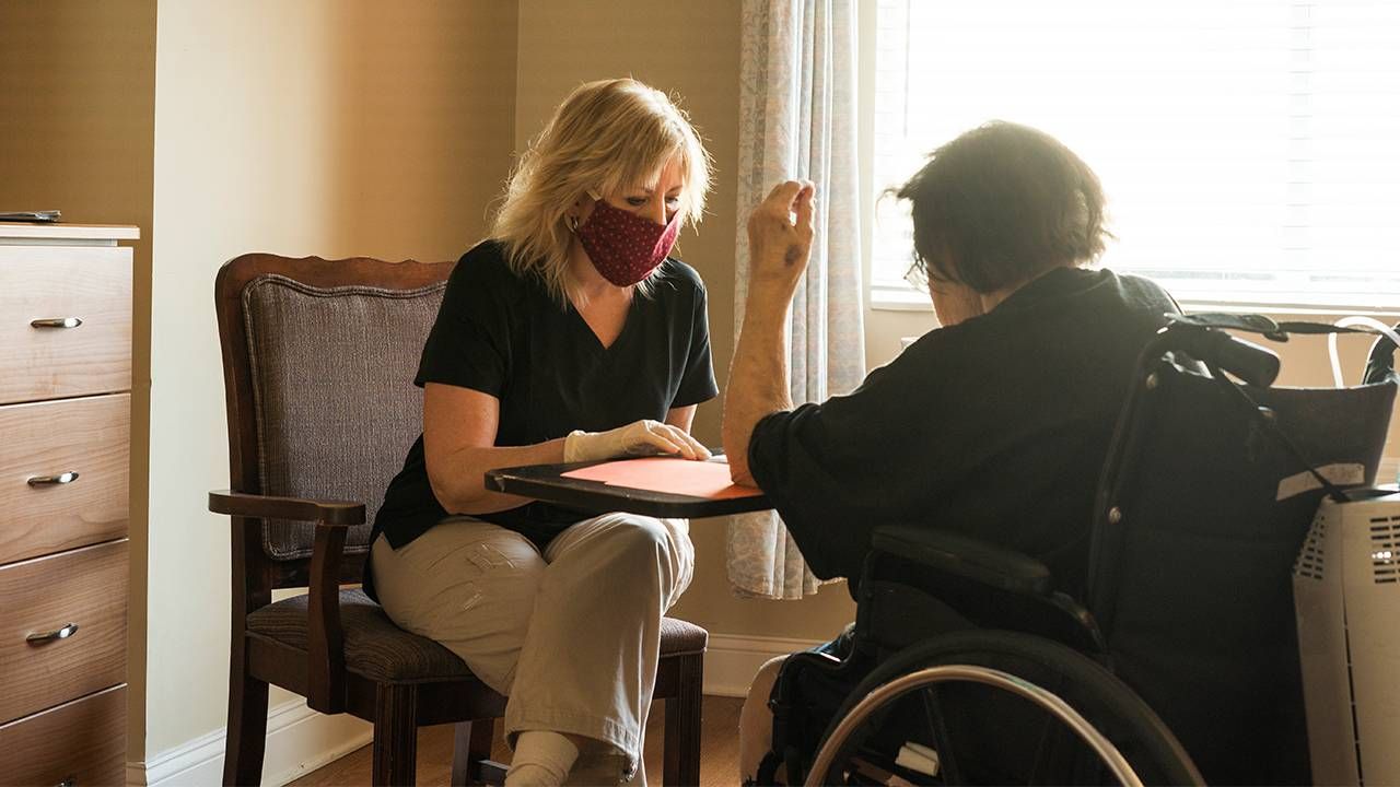 Home health aide meets with a patient, jobs, work, pandemic, Next Avenue