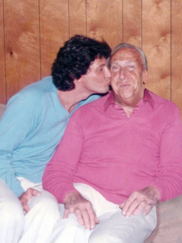 A 1980's photo of the author kissing his father on the cheek, dad, father, memoir, Next Avenue